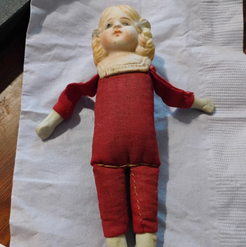 Vintage Porcelain Doll in Red Outfit